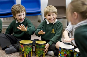 pupils playing bongos